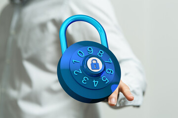 Secure combination lock with numeric dial in hand, representing data protection, encryption, and safe technolog