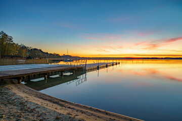 Pier at Lubikowo lake at sunset. Poalnd