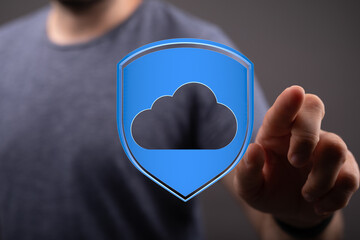 Secure cloud data storage with digital shield and finger touching the icon, showing data protection...