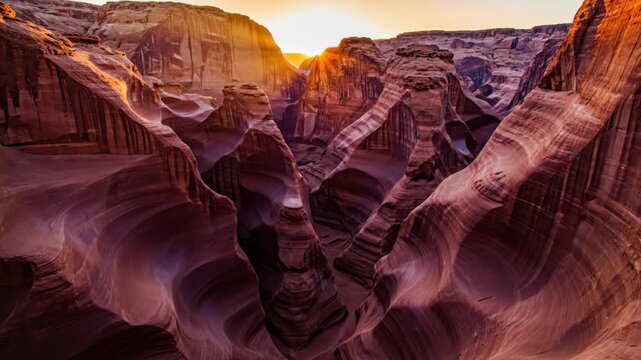 Sunlight beams piercing through the narrow, winding sandstone walls of antelope canyon, illustrating the erosion and natural beauty of this famous geological formation in arizona