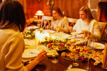 A festive set table. Delicious dishes and glasses of champagne. Beautiful bokeh
