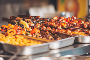 Delicious skewers and grilled vegetables at a vibrant outdoor market in summer, showcasing local flavors and aromas