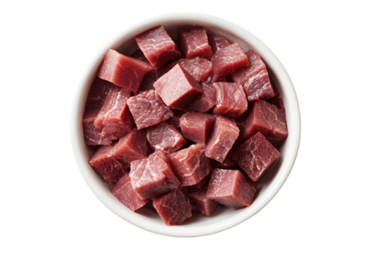 a bowl of cubes of meat on a white surface