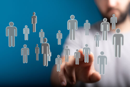 Connecting people network concept with floating human icons. Person touching digital human figures. Teamwork an