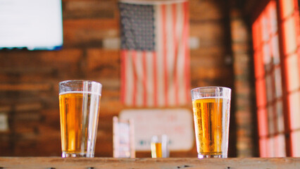 Glasses Of Beer On Table In Empty American Sports Bar