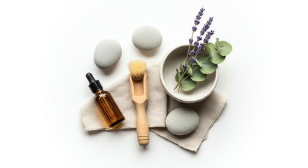 Top view of spa treatment arrangement with essential oil, stones, brush, lavender and eucalyptus