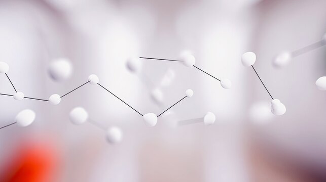 A close-up, abstract view of interconnected white spheres linked by thin black lines, set against a softly blurred background.