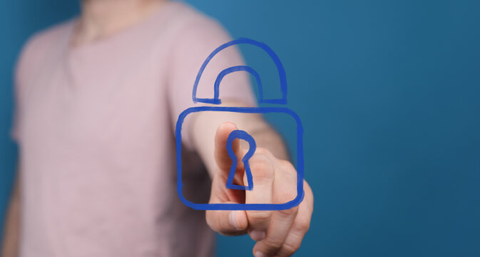 Person interacts with digital padlock, symbolizing online security, data protection, and privacy.