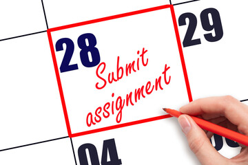28 th day of the month. Hand writing Submit assignment reminder and drawing red frame on calendar with red pen on white background. Business concept. Planning and scheduling