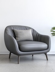 Modern gray armchair with soft cushion, featuring sleek lines and a minimalist design, set against a bright wall, creating a stylish and inviting atmosphere
