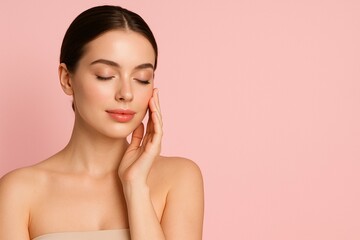 Elegant woman with flawless skin, gently touching her cheek on soft pink background, exuding confidence and serenity. Banner with copy space for text to advertise face and body care products