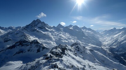 Snowy mountain range under a bright sun a winter landscape with peaks and valleys perfect for travel and adventure themes