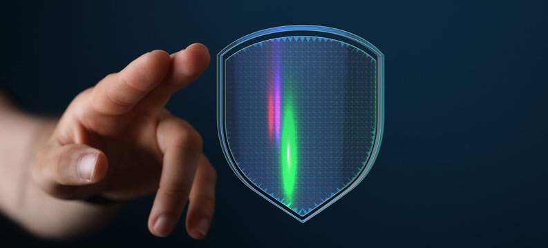 Digital protection concept with hand touching a virtual shield. Secure data, internet safety and cybersecurity visual representation.