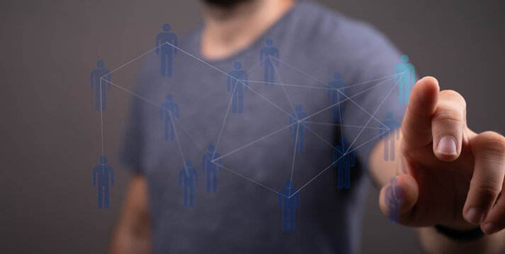 Person points at digital representation of social network and communication. Symbol of teamwork, global connect
