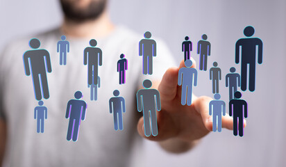 Hand reaching out to connect with network of people in digital abstract concept, teamwork, or social network. C