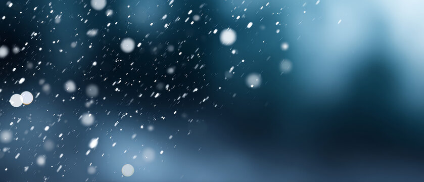 Close-up of snowflakes falling in a dark blue blurred background with bokeh light effects and motion blur