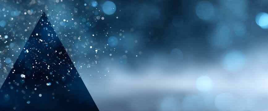 Abstract dark blue triangular shape with glowing bokeh lights and sparkling particles on a blurred background