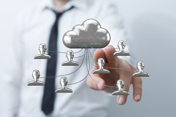 Hand touching cloud data network with user icons, representing connection and teamwork, technology and digital