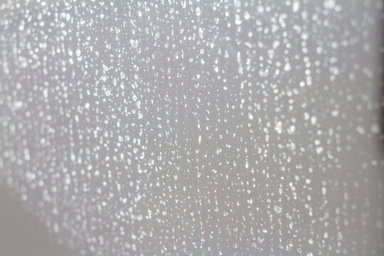 limescale stains on a shower screen