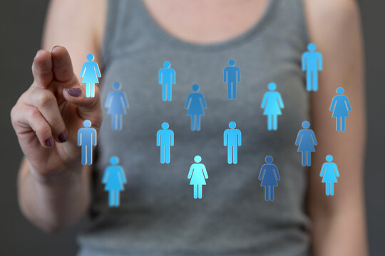 Woman's hand points to person icon, symbolizing connection, teamwork, and social media engagement. Represents networking, recruitment, or commun
