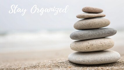 Tranquil Stacked Stones on the Beach for Mindfulness and Organization Inspiration at Calm Seaside Location