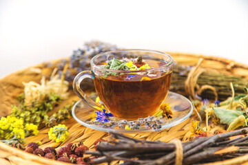 Herbal tea with medicinal herbs and flowers. Selective focus.