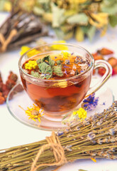 Herbal tea with medicinal herbs and flowers. Selective focus.
