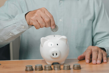 close up a coin into a white piggy bank, symbolizing financial planning, budgeting, long-term savings, and smart money management for personal finance growth.