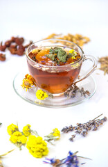 Herbal tea with medicinal herbs and flowers. Selective focus.