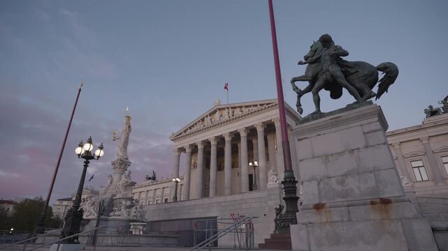 Austrian Parliament and Pallas Athene Fountain at Dusk , Vienna Austria Landmarks with Horse Tamer Statues