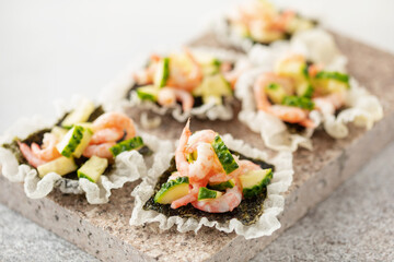 Cucumber and Shrimps on Crispy Rice Chips. Trend snack