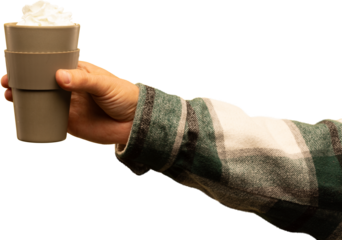 Hand holding takeout warm drink with whipped cream in plaid sleeve on transparent background. Concept of everyday winter lifestyle, cafe branding, warm beverage marketing, and casual seasonal mood.