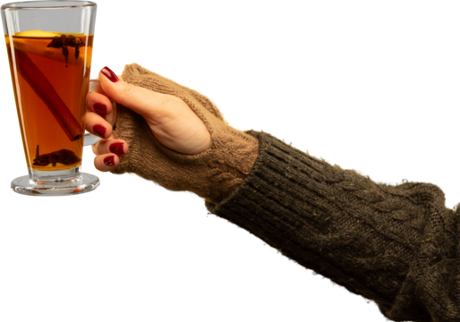 Hand in brown fingerless gloves holding hot spiced tea in tall glass on transparent background. Concept of everyday winter lifestyle, cafe branding, warm beverage marketing, and casual seasonal mood.