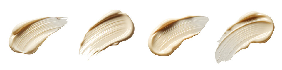 Four smears of beige cosmetic cream isolated on transparent background