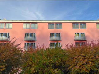 Pink hotel building in Prague. 
Hotel NH Prague City. 