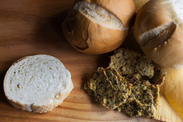 White bread,wholemeal, multigrain bread and golden toasted slices presenting different types of carbohydrates for a healthy and balanced breakfast