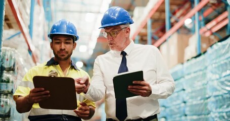 Supply chain, tablet and men in warehouse with clipboard for distribution, shipping and inventory. Walking, storage depot and supervisor on digital tech meeting for inspection, logistics or checklist - Powered by Adobe