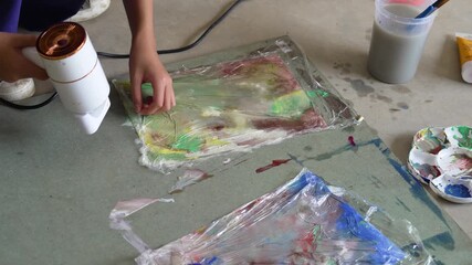 Children creating colorful watercolor paintings in art class activity - Powered by Adobe
