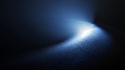 Swirling blue particles illuminated against dark background darkness abstract