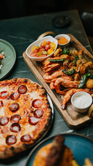 A table with a variety of food, including pizza, shrimp, and vegetables. Scene is casual and inviting, as it is a buffet-style meal