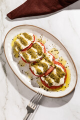 Top view of caprese salad isolated on kitchen countertop surface