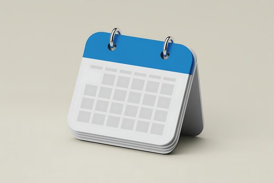 A blue and white desk calendar with metal rings sits on a plain beige background office planning