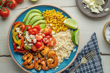 Top View Flat Lay Shot Of Grilled Shrimp Rice Bowl with Avocado and Corn