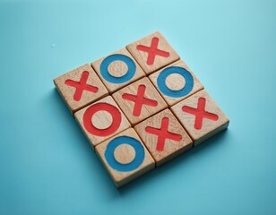 Wooden tic tac toe blocks arranged on blue background. Game of crosses and circles, strategy and fun for all ages. Classic childhood toy for leisure and simple play.