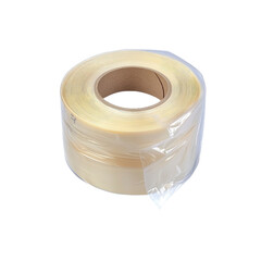 Roll of transparent packaging tape on black