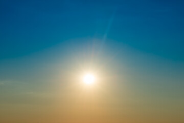 Big shining sun on sunset sky, sunset sky with sun light background