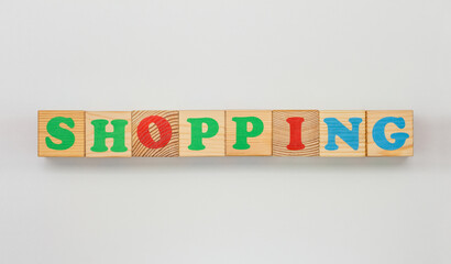 Word Shopping arranged with bright wooden letters
