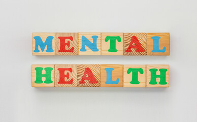 Mental health displayed with vivid wooden letter blocks