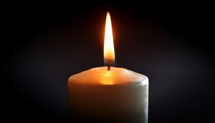 a single candle burns brightly in the darkness signifying remembrance and loss its warm flame flickers gently creating a serene atmosphere for quiet reflection