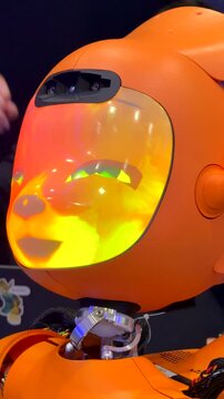  Fox robot introduces itself at COEX tech expo. Fox robot speaks with animated face showing emotions. Fox robot futuristic concept cinematic interactive AI scene.